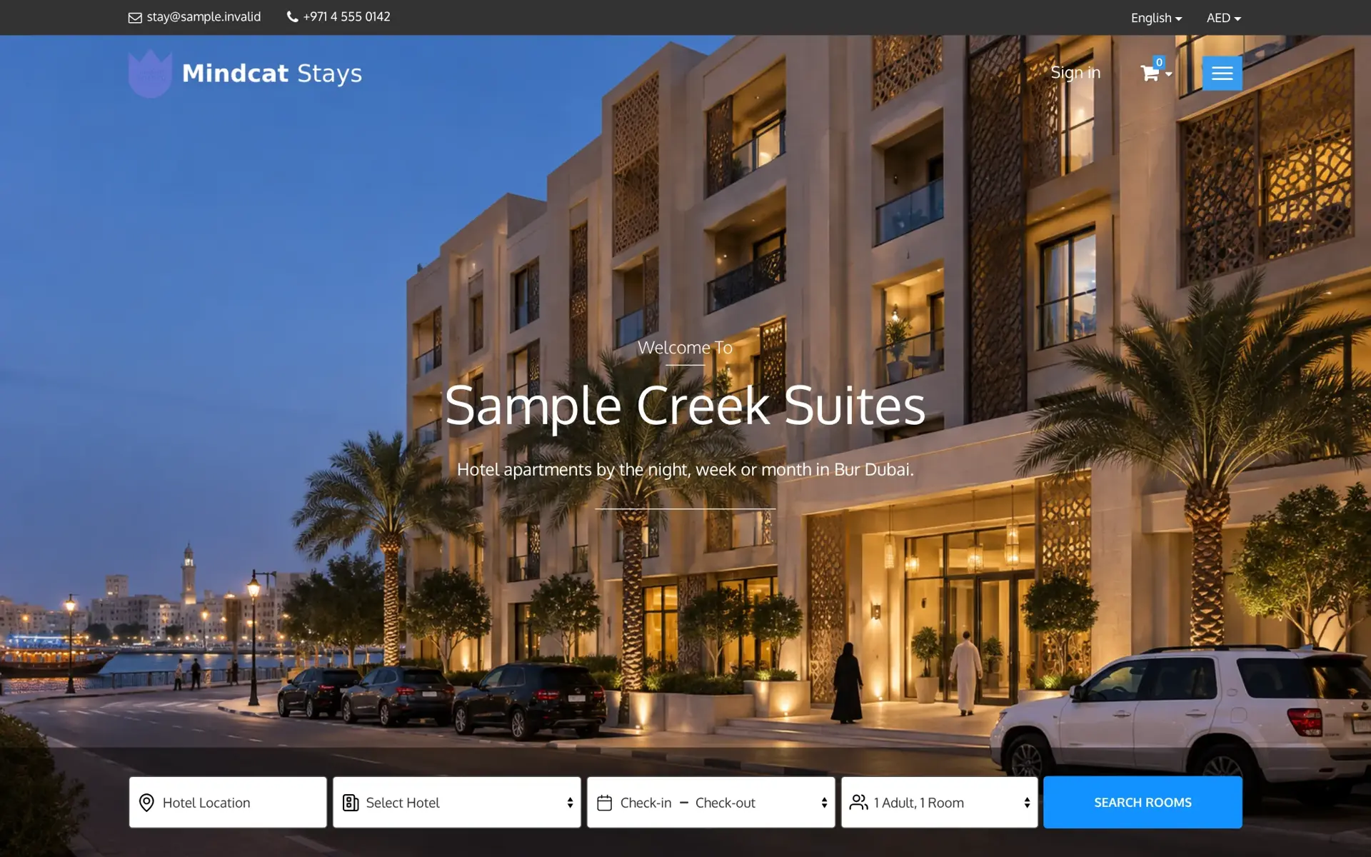 Mindcat Stays booking site for Sample Creek Suites, hotel apartments by the night, week or month in Bur Dubai, with a dusk photo of the building and a search bar for hotel location, hotel, check-in and check-out dates and guests.