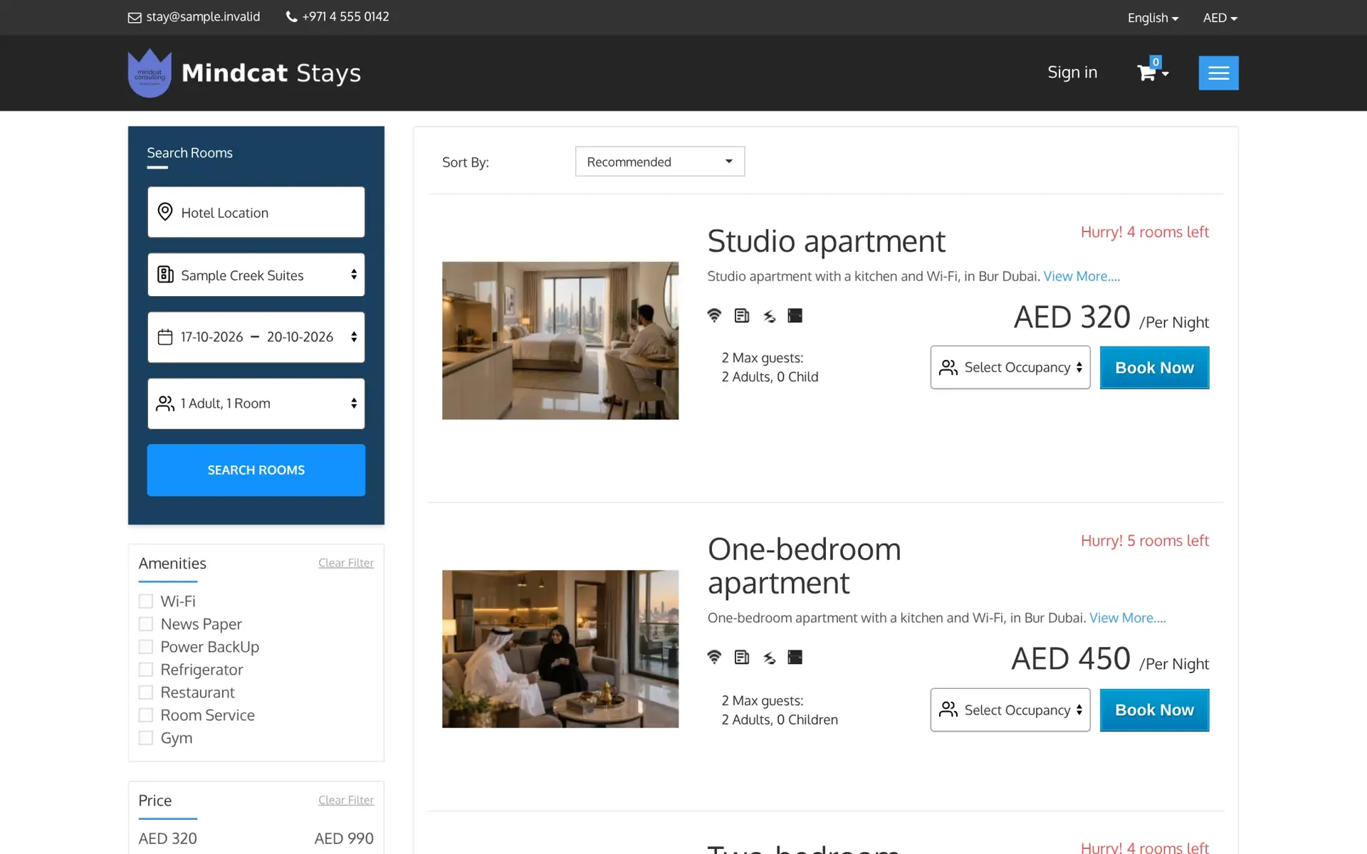 Mindcat Stays search results for Sample Creek Suites from 17 to 20 October 2026: studio apartment at AED 320 per night with 4 rooms left and one-bedroom apartment at AED 450 per night with 5 rooms left, each with a Book Now button.