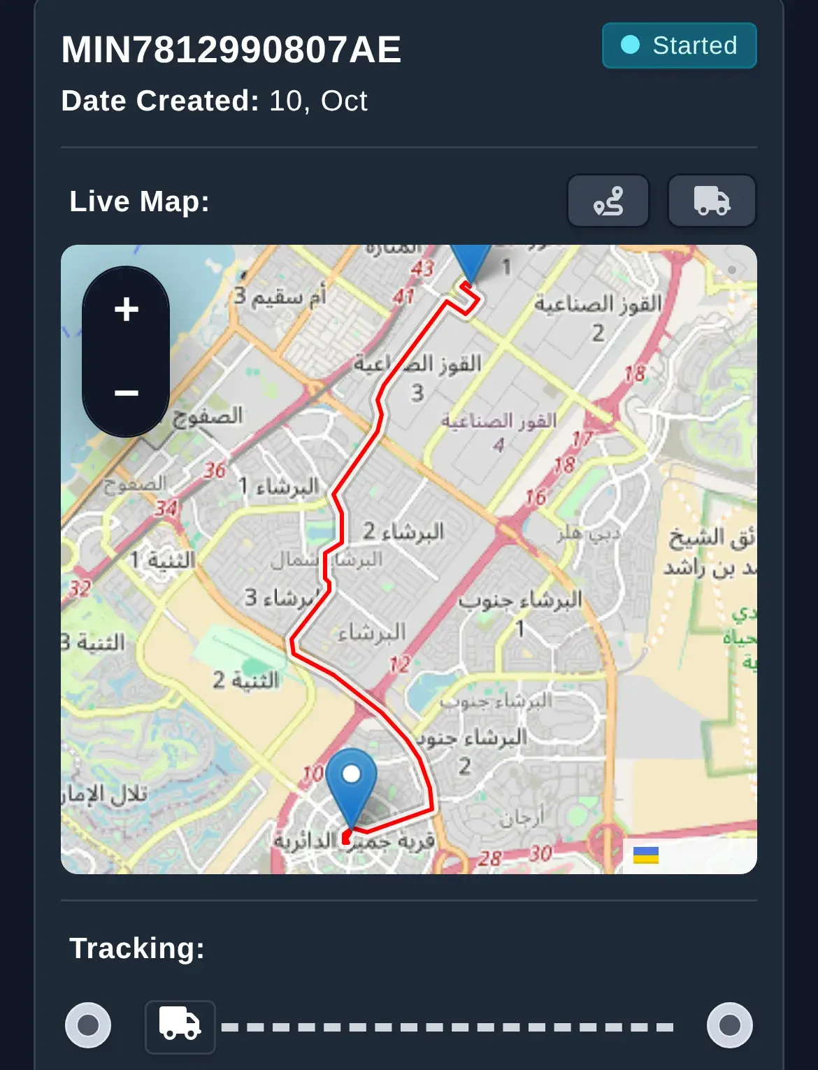 Order tracking page on a phone: the tracking number, status Started, and a live map with the route from Al Quoz to Jumeirah Village Circle in Arabic street names.