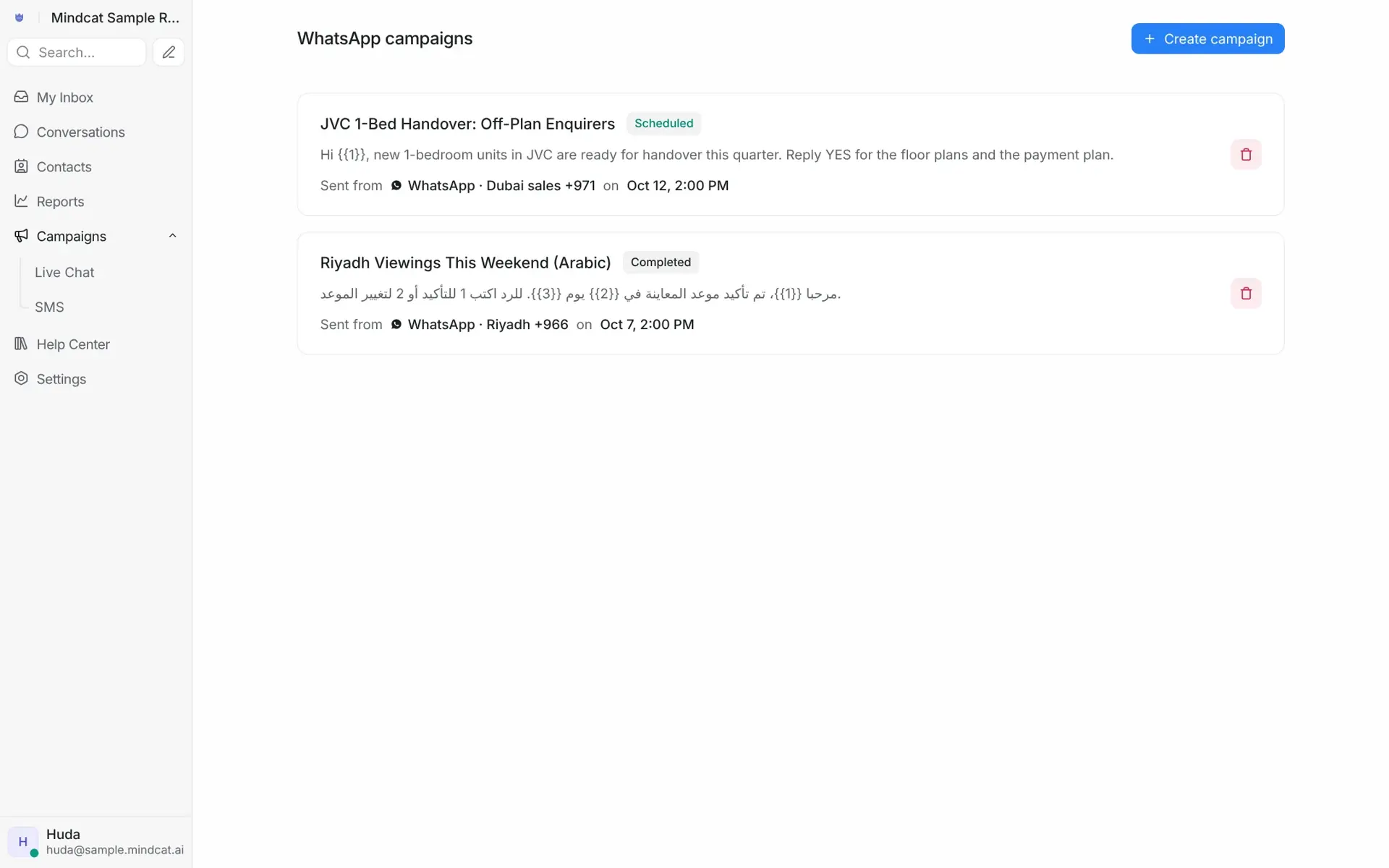 Mindcat Inbox WhatsApp broadcast list: a scheduled campaign “JVC 1-bed handover: off-plan enquirers” on the Dubai number and a completed Arabic campaign “Riyadh viewings this weekend” on the Riyadh number.